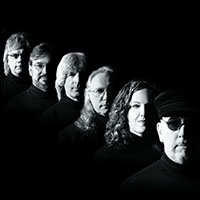 headshot of six musicians black and white