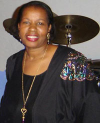 female afro american singer in black dress